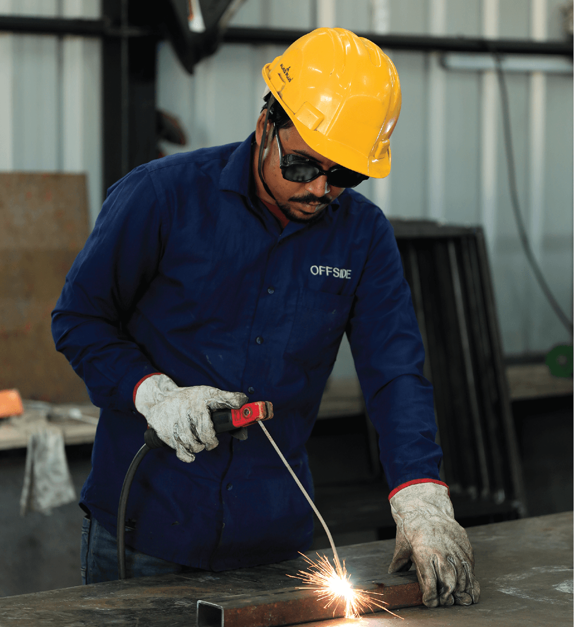 Offside Works mission — metal fabrication welding work with sparks, Surat